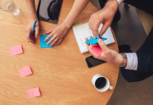 Brainstorming session with post it notes on table