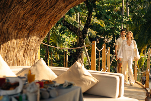 Happy couple enjoying luxury treehouse resort in Maldives tropical destination