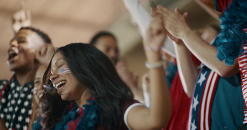 Group of USA supporters cheering loudly