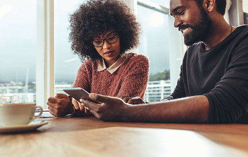 Business colleagues  discussing work at office on a tablet computer