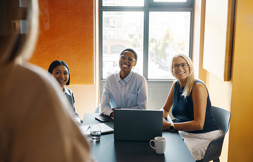 Group of diverse professionals in a positive business meeting setting