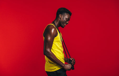 African man relaxing after workout