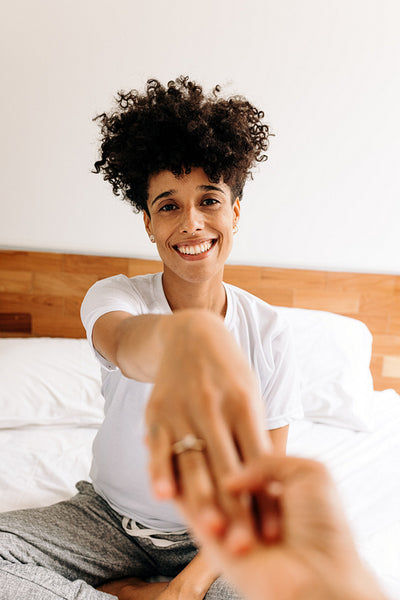 Cheerful gay woman showing off her engagement ring