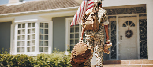 Back view of a military mom returning from the army