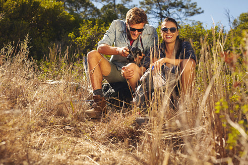 Young couple on hiking trip taking a break