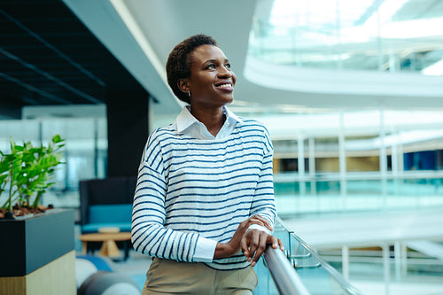 Successful female professional confidently smiling in modern office