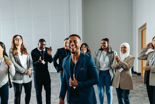 Confident male leader energizing group during a conference