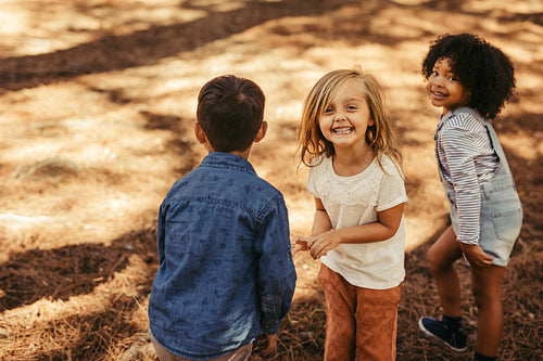 Group of children playing in forest