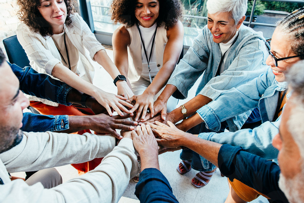 Team unity in the workplace with diverse business colleagues collabora ...