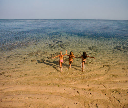 Female friends having fun on beach vacation