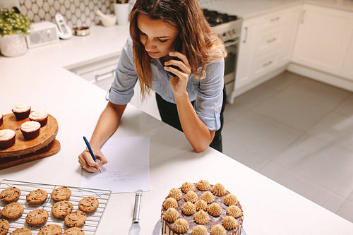 Confectionery owner taking order