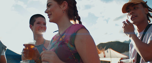 Young vibrant friends celebrate at a festival