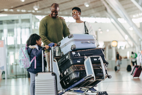 Young family waiting at airport
