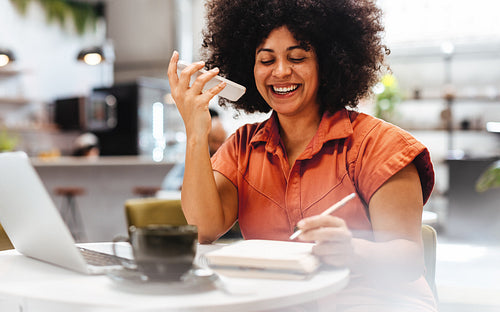 Woman communicating with her business clients on a phone call