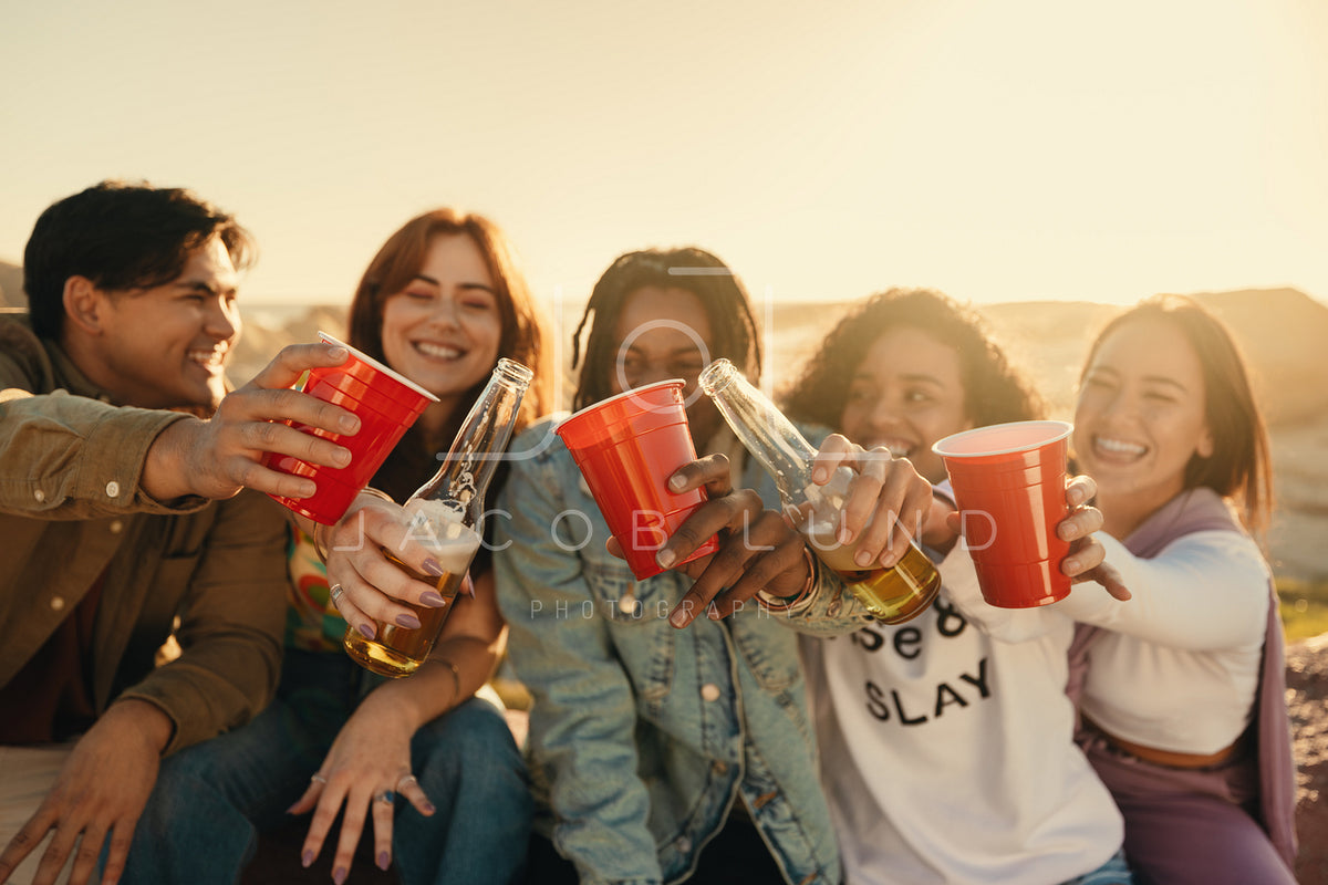 Group Of Friends Cheering And Drinking With Happiness Outdoors Jacob