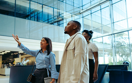 Confident manager onboarding new recruits in a bright corporate office setting