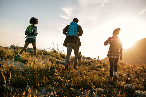 Three young friends on a country hike