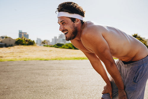 Tired sportsman relaxing