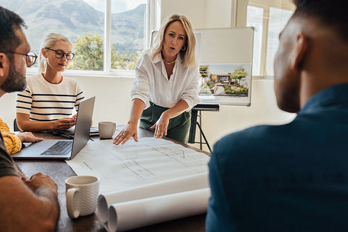 Team discussion in a modern architecture firm with professionals in an office