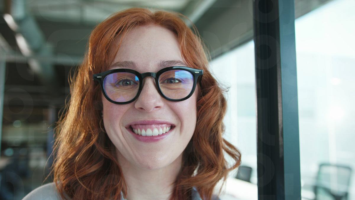 Business woman smiling at the camera in an office – Jacob Lund ...