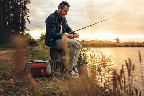 Man enjoying fishing near a lake