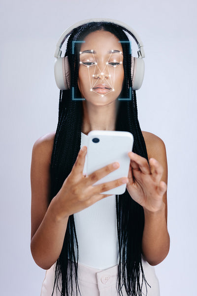 Face ID: Young woman scanning her face on her smartphone to gain access