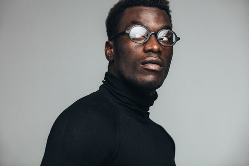 Thoughtful african man staring away