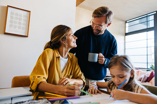 Family at home enjoying art and conversation