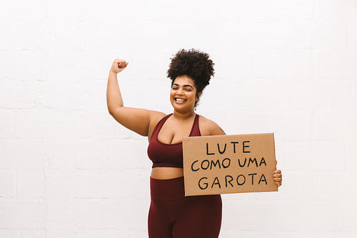 Healthy woman with "Fight like a girl" banner