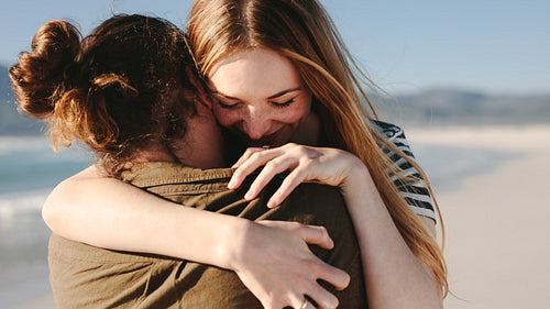Romantic couple embracing each other on the beach