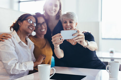 Group of businesswomen taking selfie