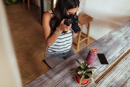 Woman taking photo for her blog