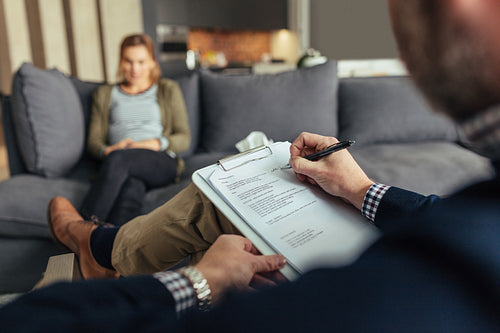 Psychologist during therapy session with female patient
