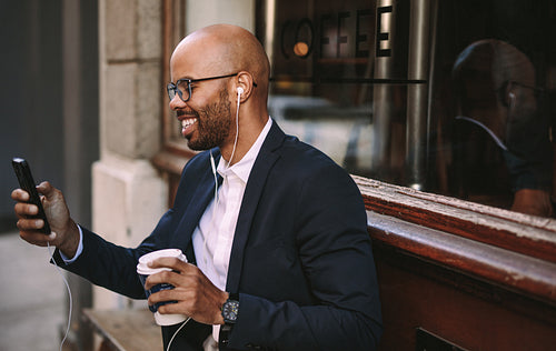 African businessman making a video call with smartphone