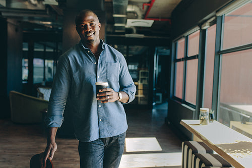 Executive having a coffee break at work