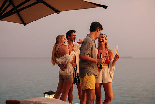Family enjoying a luxurious holiday at the beach, celebrating special times together