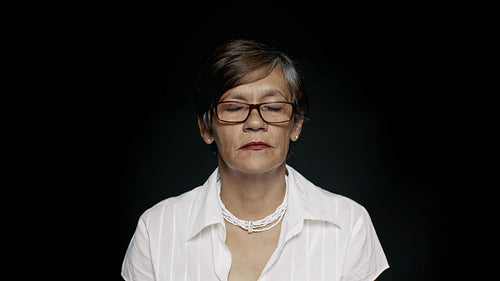 Senior woman with eyes closed