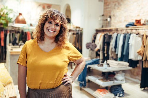 Woman standing in a fashion boutique