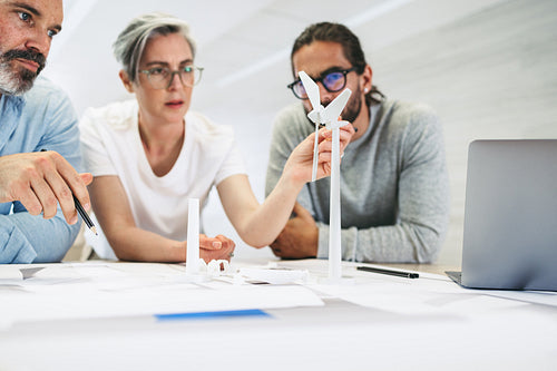 Innovative businesspeople working on a wind turbine project