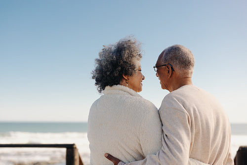 Mature lovebirds at the beach