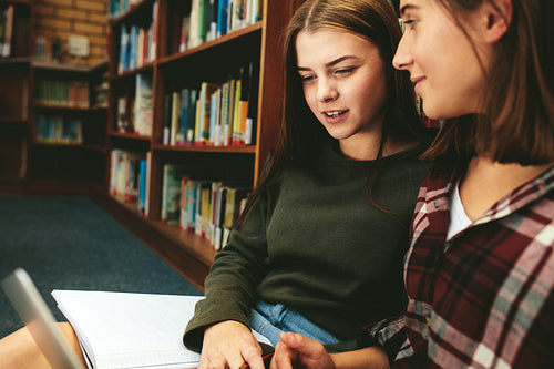 Female students studying in the library