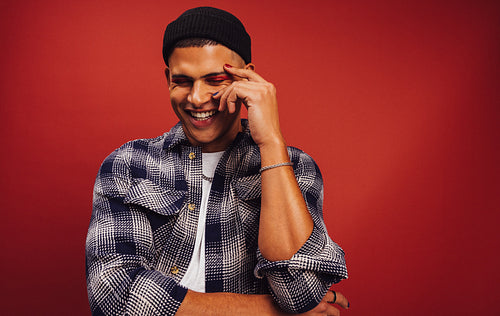Fashionable young man smiling in a studio