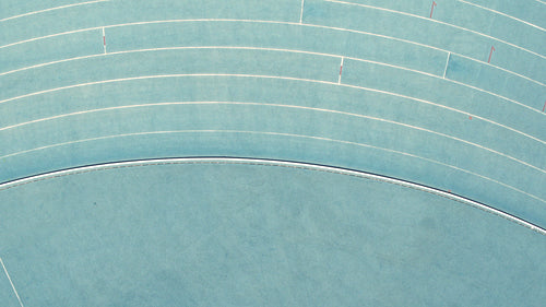 Runner practicing with parachute attached on back