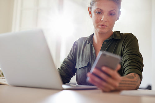 Attractive young woman using smart phone