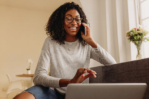 Businesswoman working from home on laptop