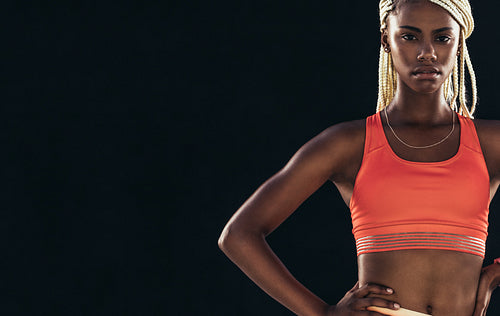 Portrait of a female athlete in fitness clothes