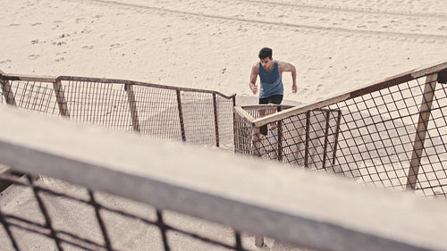 Runner exercising on the steps at the beach