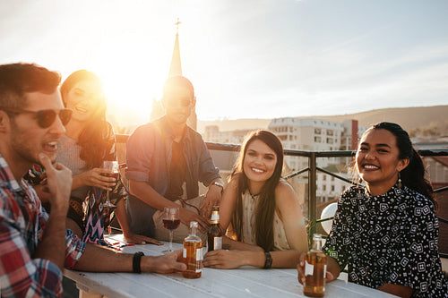 Group of happy young people having party