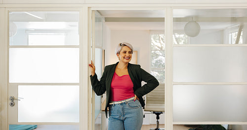 Happy young businesswoman smiling in an office
