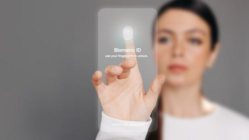 Fingerprint lock: Woman using a biometric ID to unlock a device
